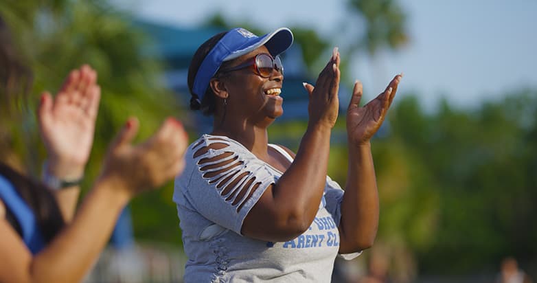 Parent cheering at game